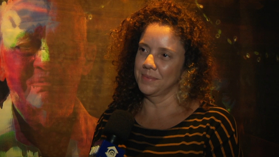 Cecília Bedê, curadora da 75ª edição do Salão de Abril, é entrevistada no telejornal (Foto: Leandro Pozo)